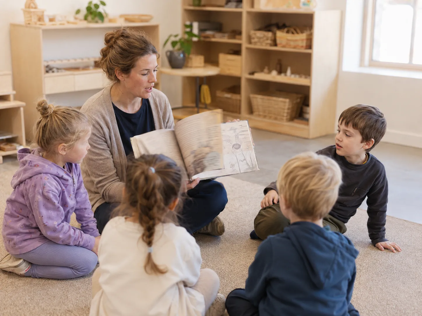 Educator leading a small-group story and discussion